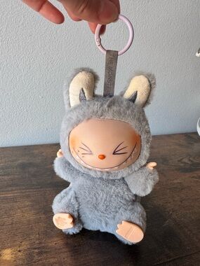 Pop Mart The Monsters Have A Seat Labubu HEHE Grey Sesame Plush Vinyl Pendant